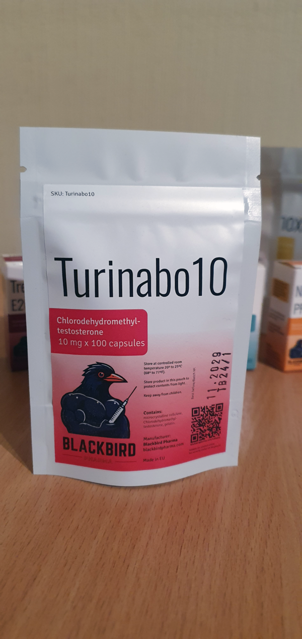 A product display of Turinabo10 (Turinabol 10 mg/capsule) on a wooden tabletop.